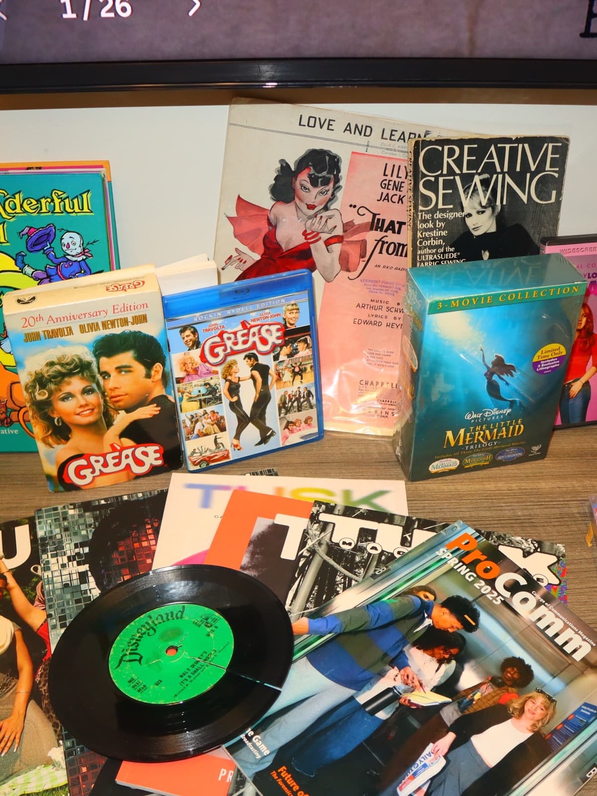 Physical media collection on display · 03