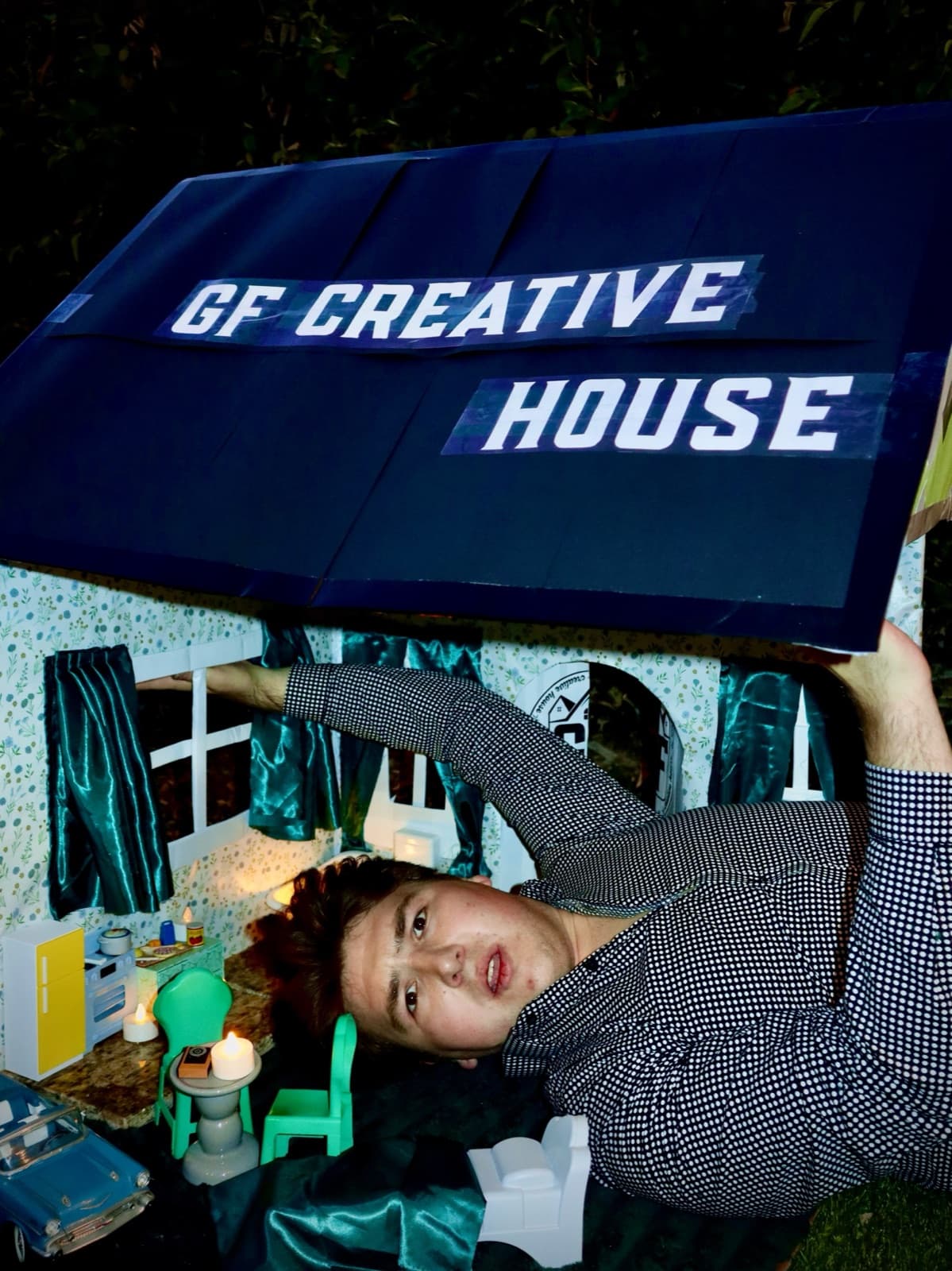 Gregory Ferraro holding up the GF Creative House roof · 02